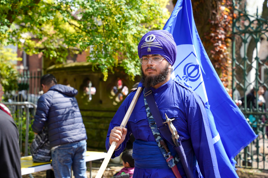 A man carries a flag