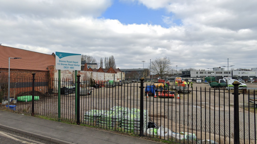 A Google Street view of the Stores Road Depot showing vehicles and workers on the site
