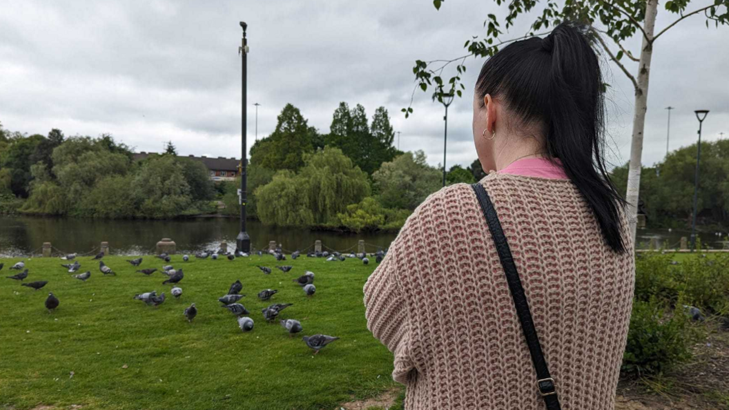 Jenna in the River gardens with birds