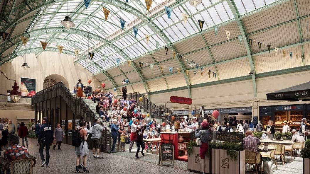 A CGI image of how Grainger Market would look after the renovation. There are a number of food stalls, including one at the centre of the space. It is bright with strings of small yellow, blue, black and white flags hanging form the ceiling. People are having food and walking around.