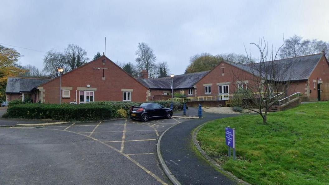 The Grange at Eckington - a single storey modern brick building surrounded by grassed areas and parking