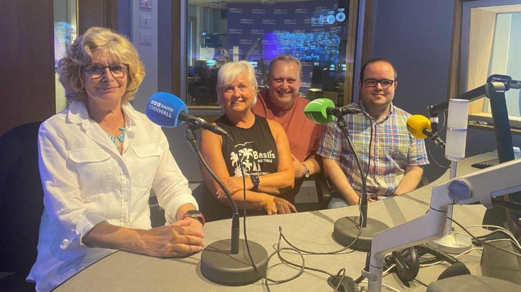 Two women and two men in a BBC Radio Cornwall studio.