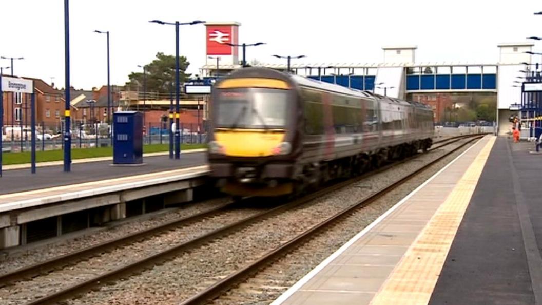 Train running through Bromsgrove railway station