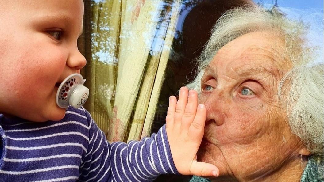 baby-and-grandma-at-window.