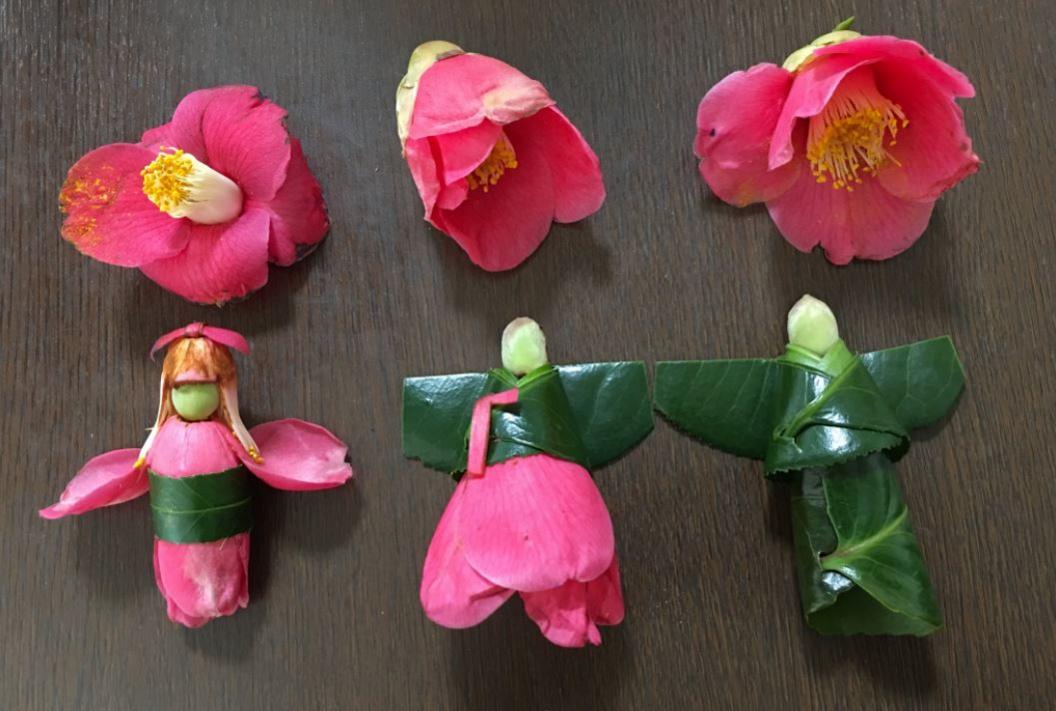 Three people made from leaves and flowers