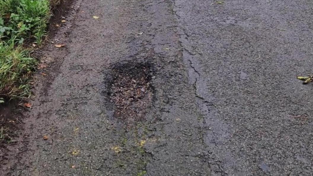 A pothole on a country lane