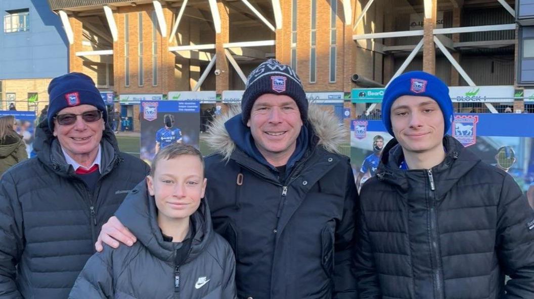 Joe Bryant with his family outside Portman Road stadium.