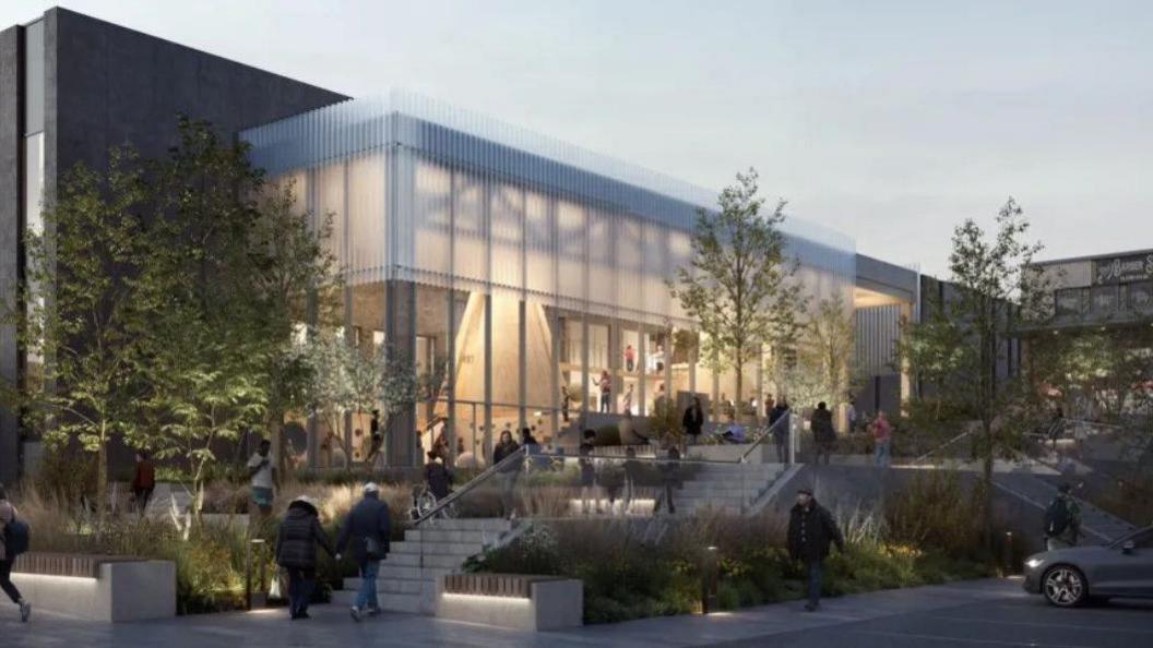 A CGI image of how the front of the new complex would look. It shows the building in the dusk, with its big windows lit up, and people walking inside and outside.