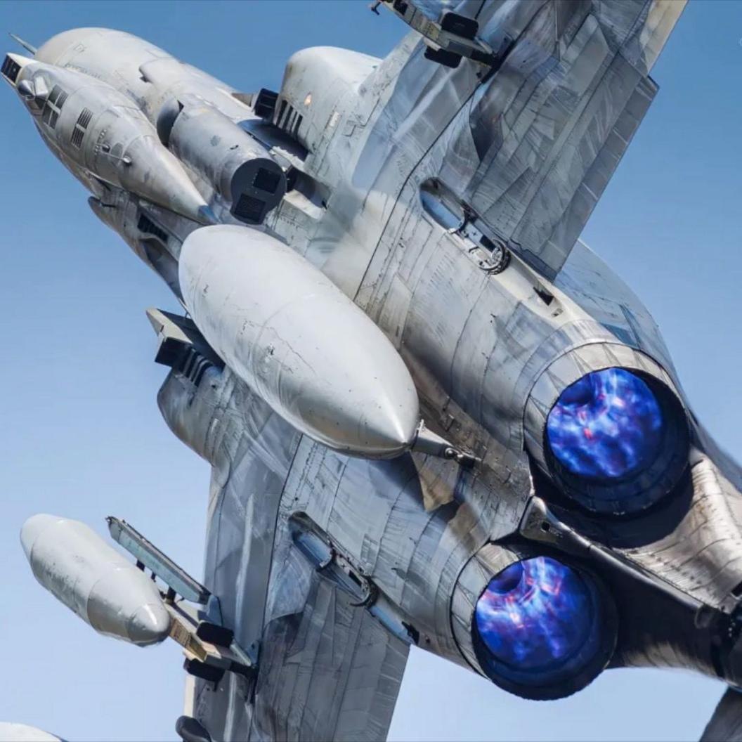 A photo of the Hellenic Air Force F-4 taken by Ben Smith. The jet's engines can be seen shooting brightly coloured flames