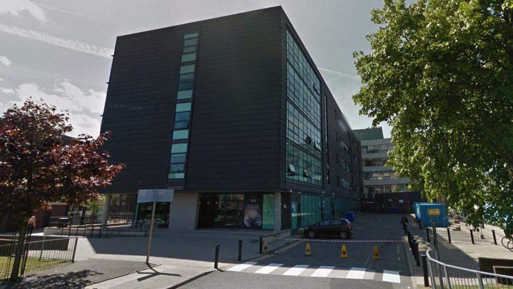 Streetview of the Sandyford Building, a large rectangular building with lots of windows