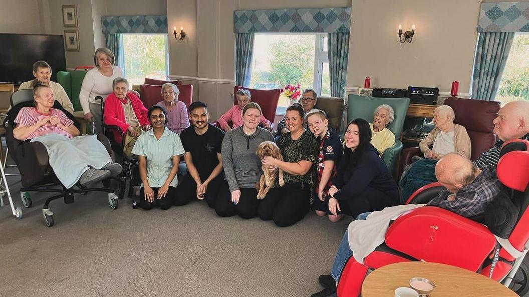 Winnie with residents in a care home