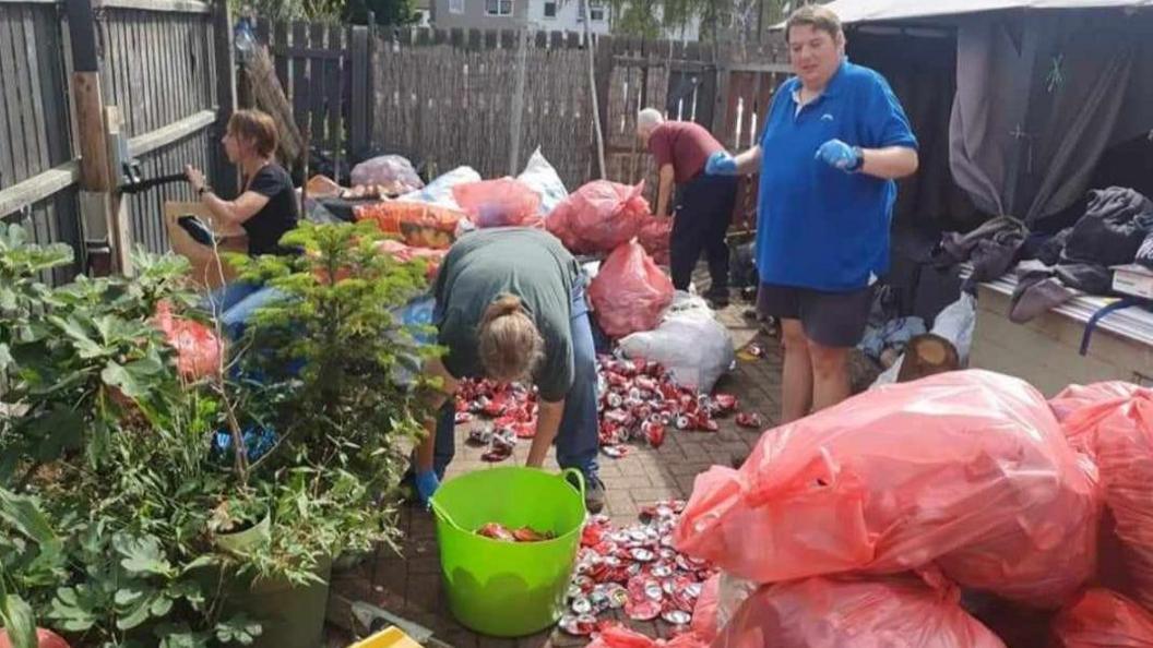 Cans being packed in bags