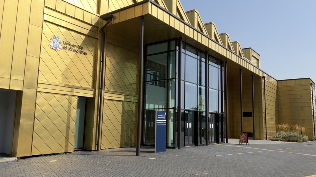 The golden walls on the side of the Three Counties Medical School