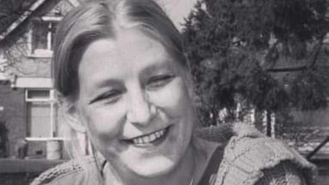 A black and white photo of Dawn Sturgess smiling