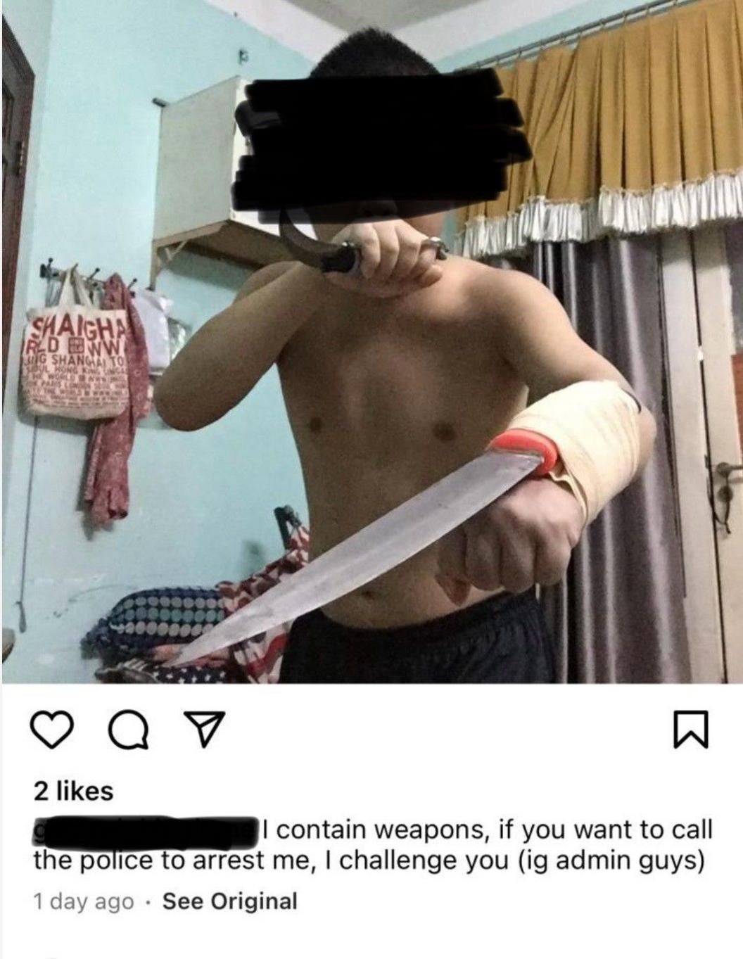 A man with a sword bandaged to one arm and a knife in the other 