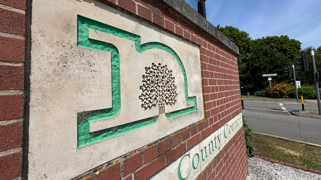 Nottinghamshire County Council headquarters with the council name visible on a red brick wall
