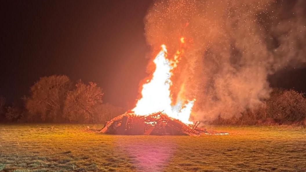 A bonfire alight on the grounds of Sileby Town Cricket Club in Leicestershire