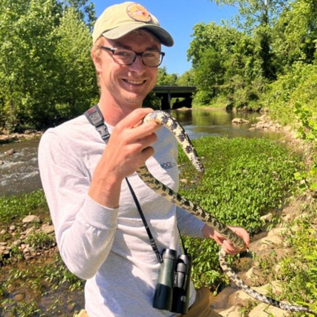 Zoologist Andrew Rapp, seen holding an Eastern Kingsnake.