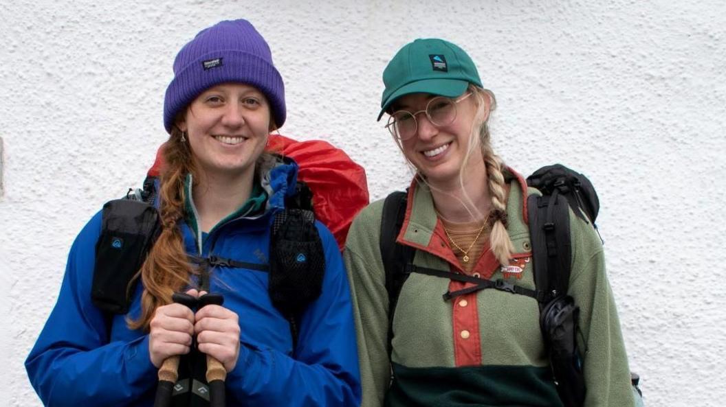 Ally Turner and Glynis Mattheisen in their walking gear outside The Old Forge pub