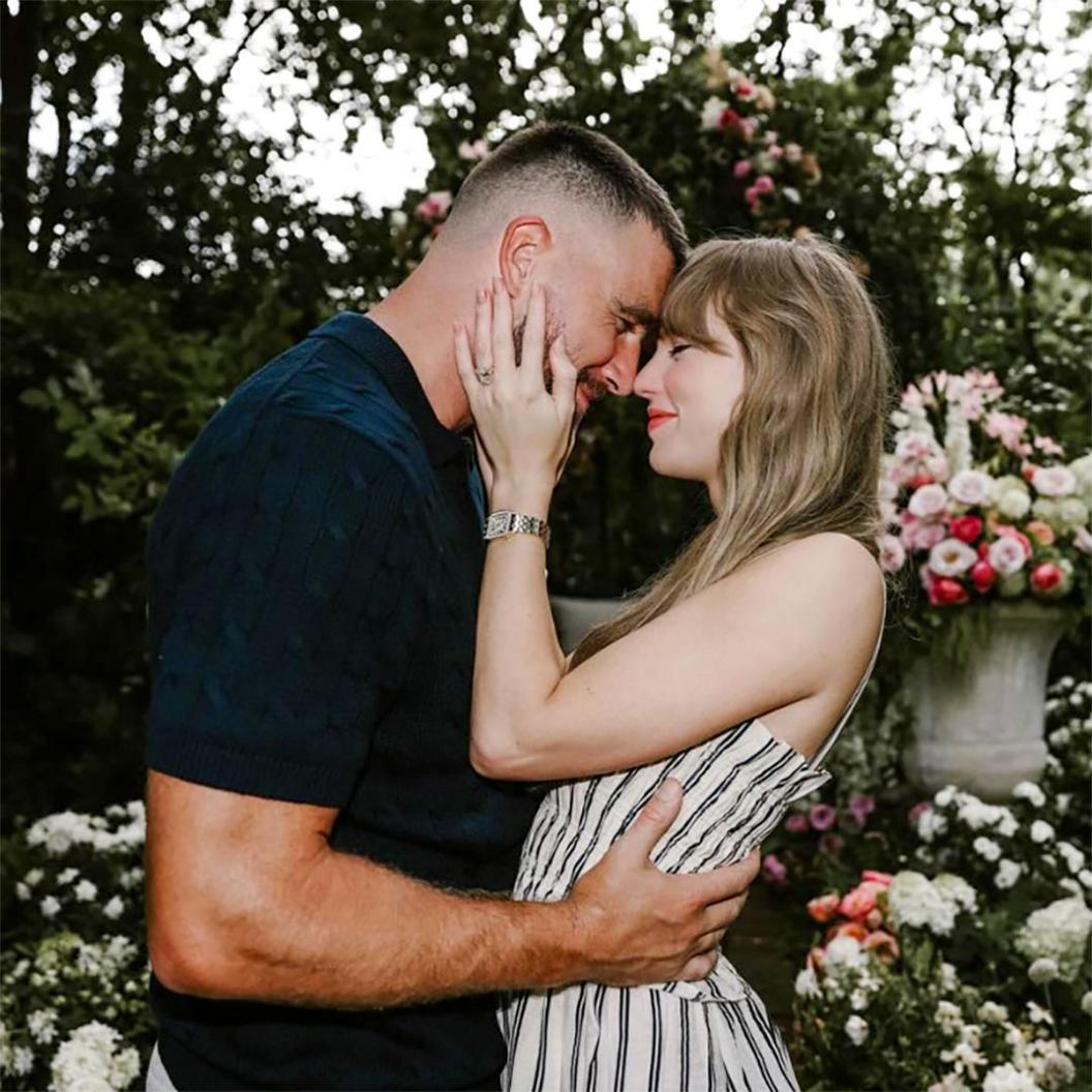 Travis Kelce and Taylor Swift embrace each other on the occassion of their engagement