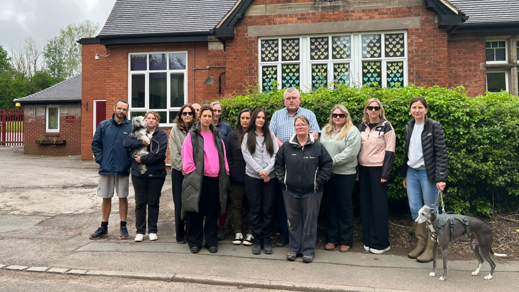 Parents and carers outside the school