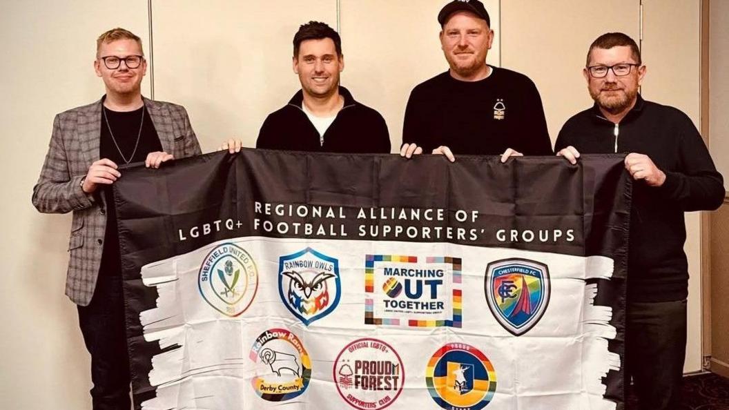 Chris Ledger and James Laley pictured with fellow LGBTQ+ supporters groups members