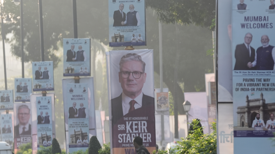Banners of Indian Prime Minister Narendra Modi welcoming British counterpart Sir Keir Starmer are seen along a street on October 8, 2025 in Mumbai, India.