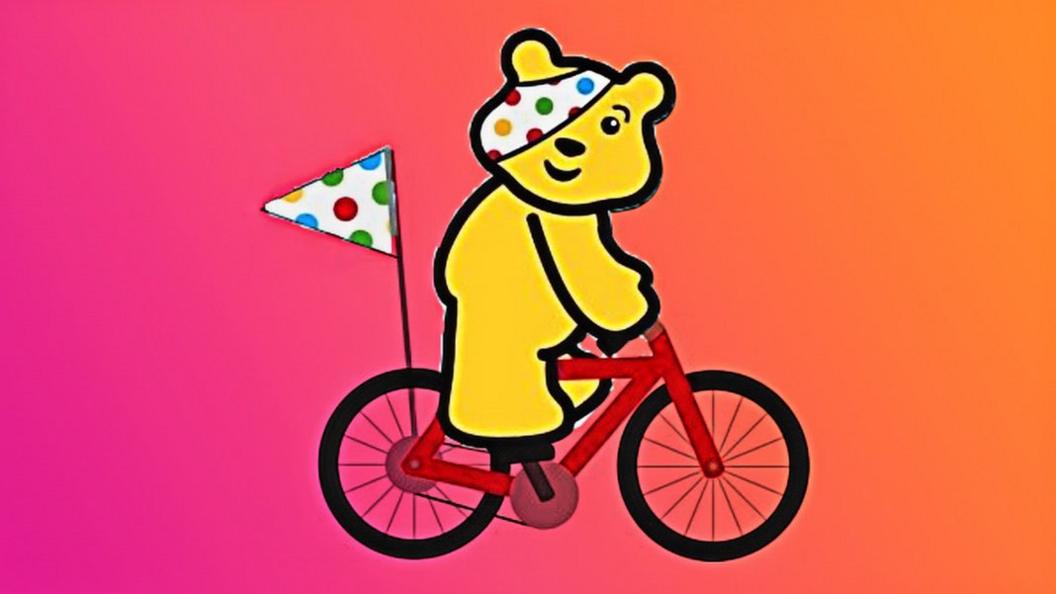 Pudsey on a bike.