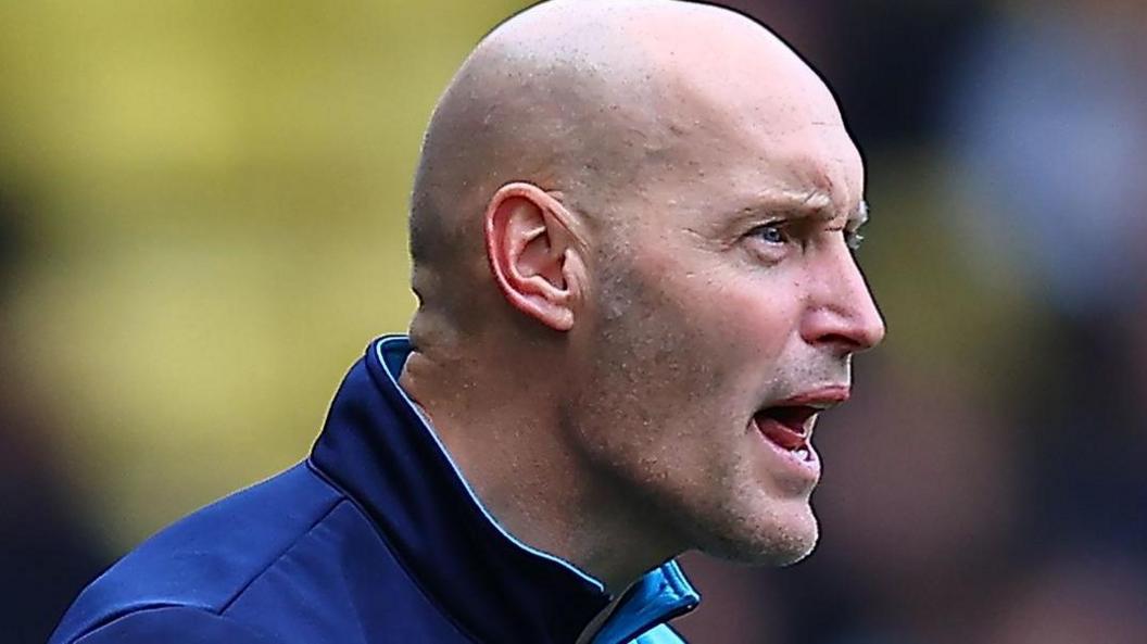 Adam Barrett on the touchline for Millwall