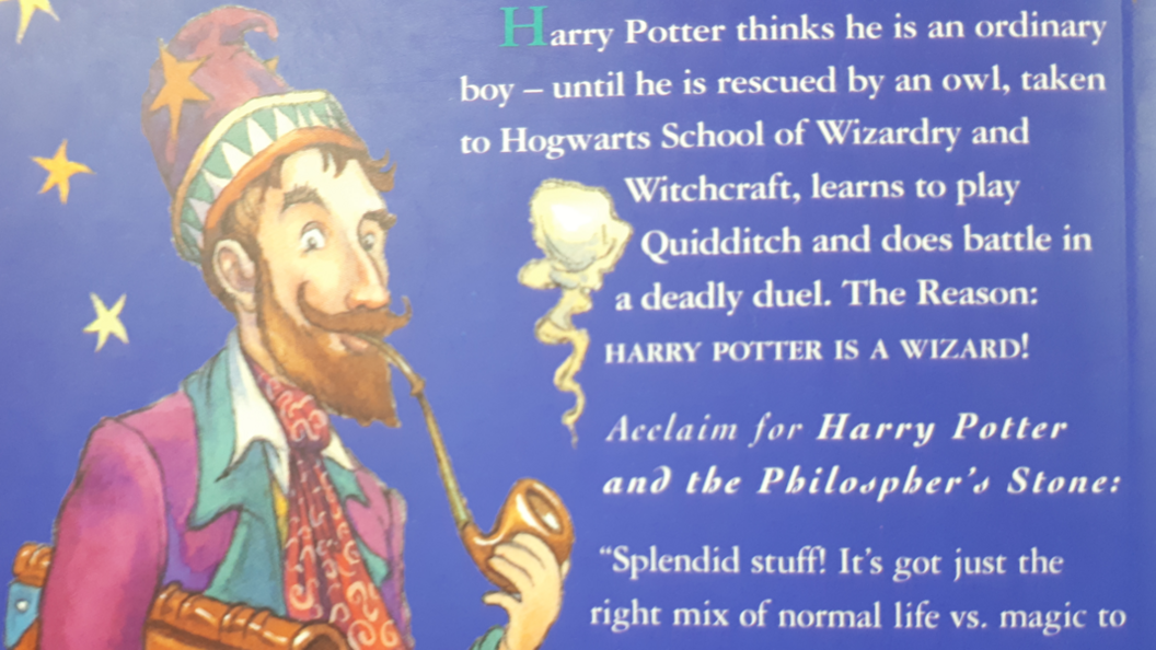 The back cover of Harry Potter and the Philosopher's Stone. A wizard is smoking a pipe and there is a spelling mistake in the blurb. 