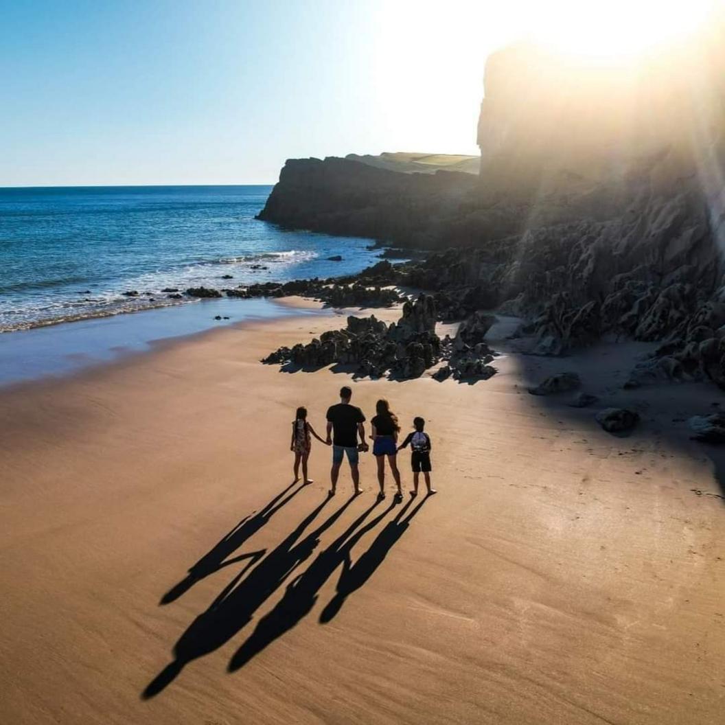 Steve and his family on a beach