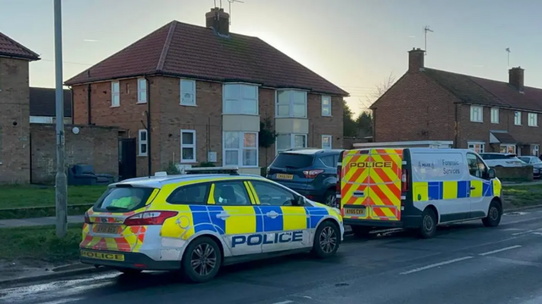 Two police cars parked outside a home in Ipswich