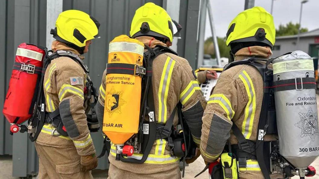 Fire fighters in breathing apparatus