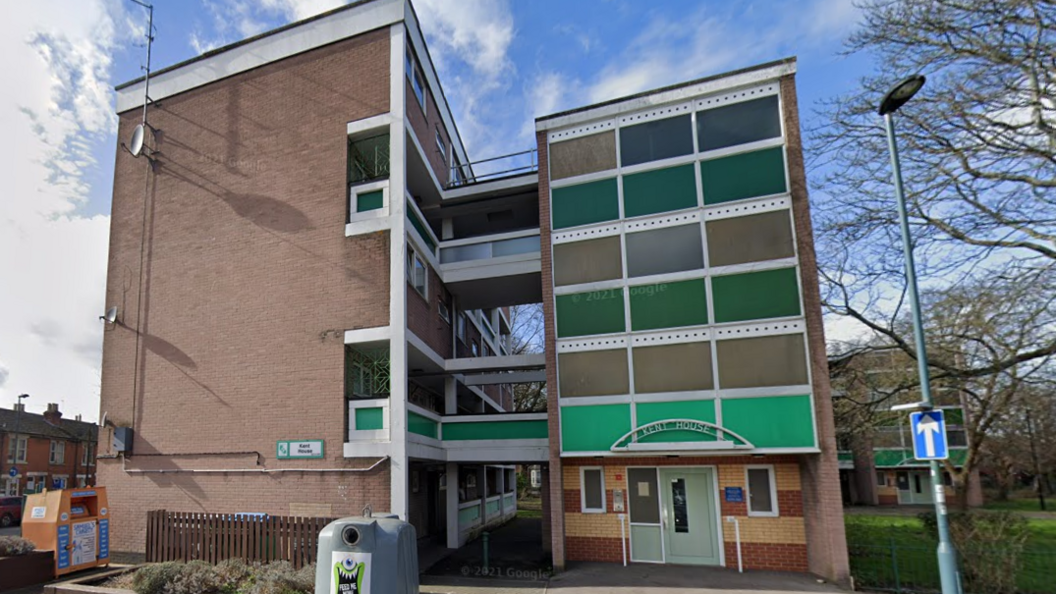 Kent House is a five-storey brick block of flats in two sections which are attached by walkways.