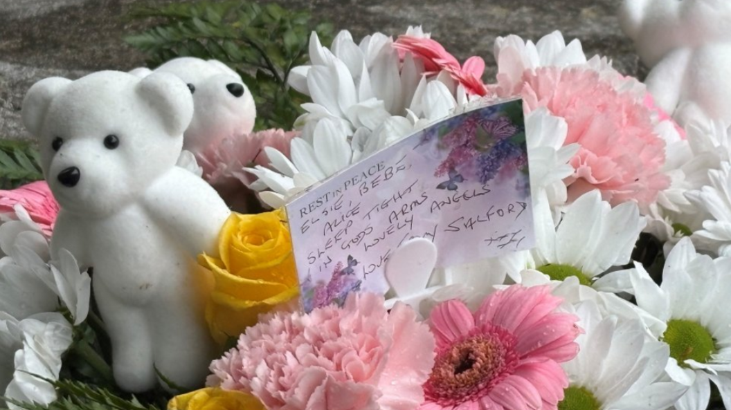 Floral tributes with a message and teddy in memory of the Southport attack victims