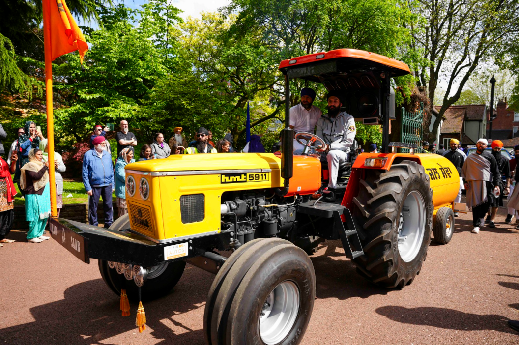 Two men on a tractor