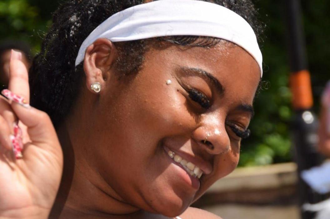 A young woman smiling and posing for a photo