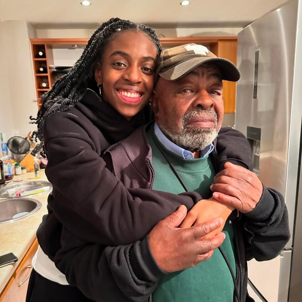 Cat Burns wraps her arms around her grandfather John.