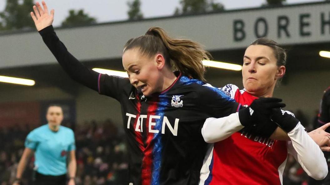 Crystal Palace's Lily Woodham and Arsenal's Steph Catley battle for the ball