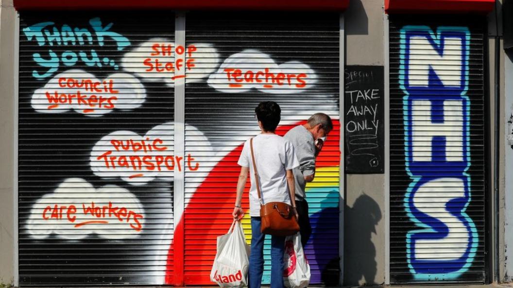 NHS mural on shop shutters in Belfast