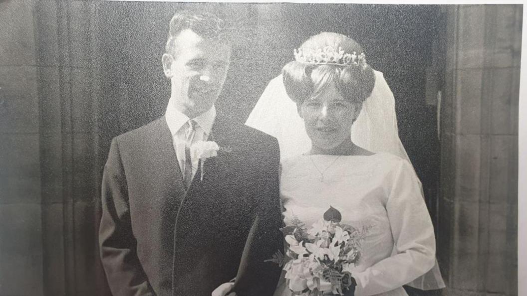 Bob Meskell and his wife Pauline Vilna Meskell on their wedding day in 1964 standing outside the church