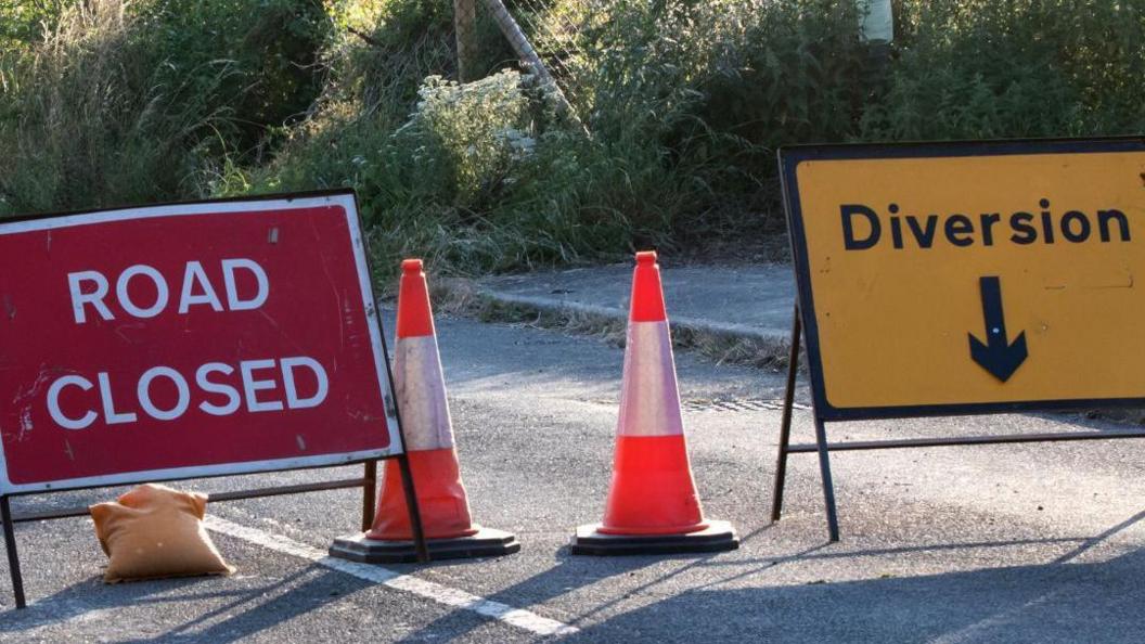 Gloucestershire County Council road signs that say "Road closed" and "Diversion".