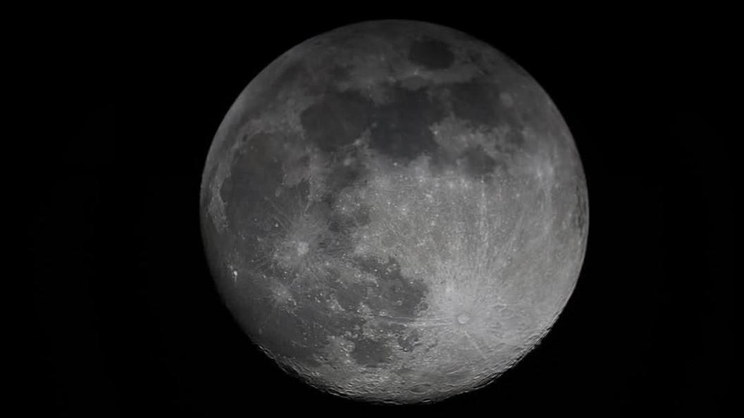 A clear image of the moon with the creases and craters visible on a black background.