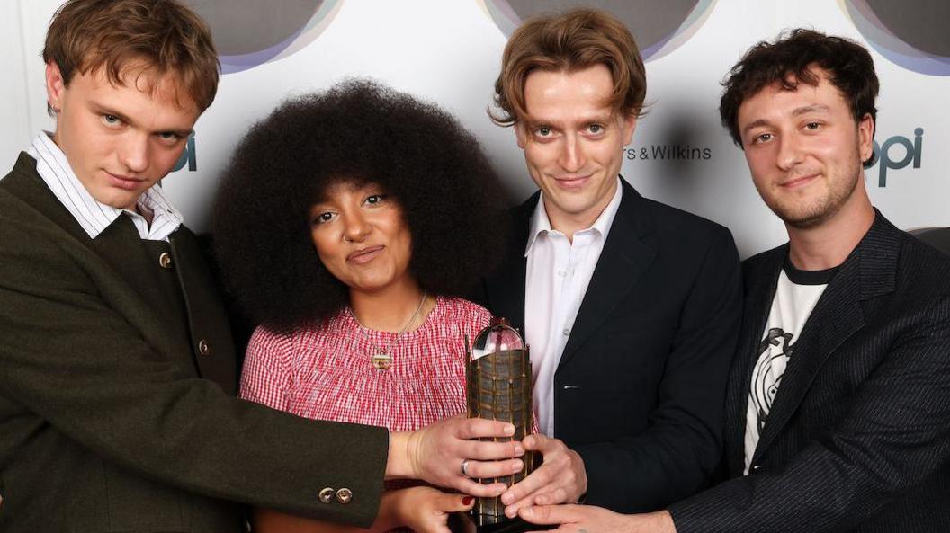 English Teacher with their trophy for the Mercury Prize