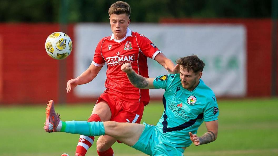 Ricky Lee-Owen of Briton Ferry Llansawel in action against Ammanford