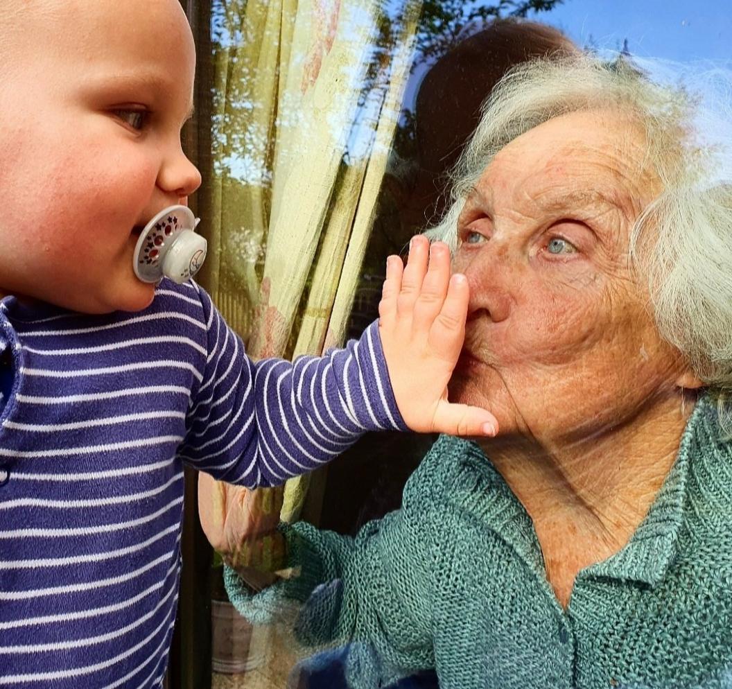 baby-and-grandma-at-window.