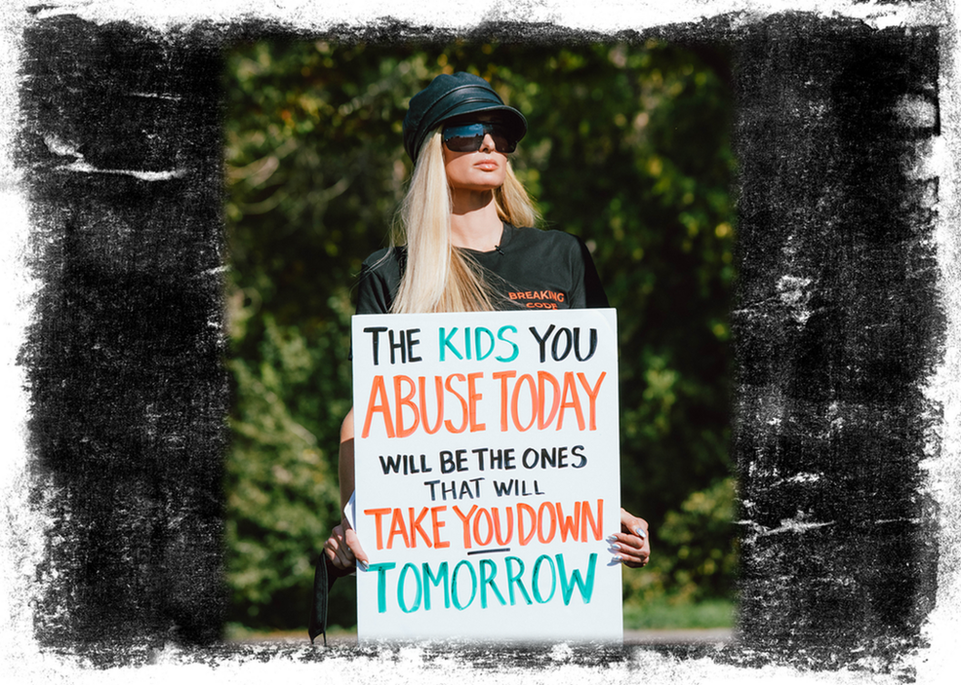 Edit shows Paris Hilton holding a sign which says "The kids you abuse today will be the ones that take you down tomorrow"