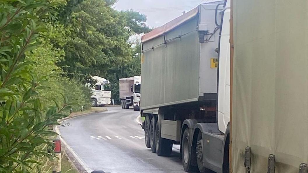 Lorries in a queue on South End, Goxhill