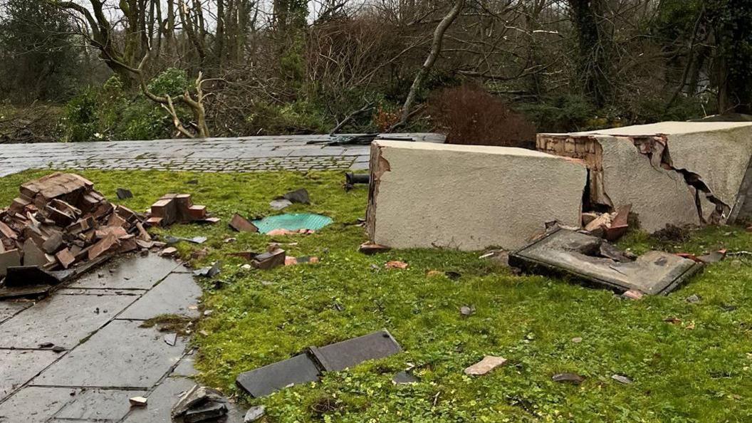 Photo of collapsed chimney stack on a patio after a tornado