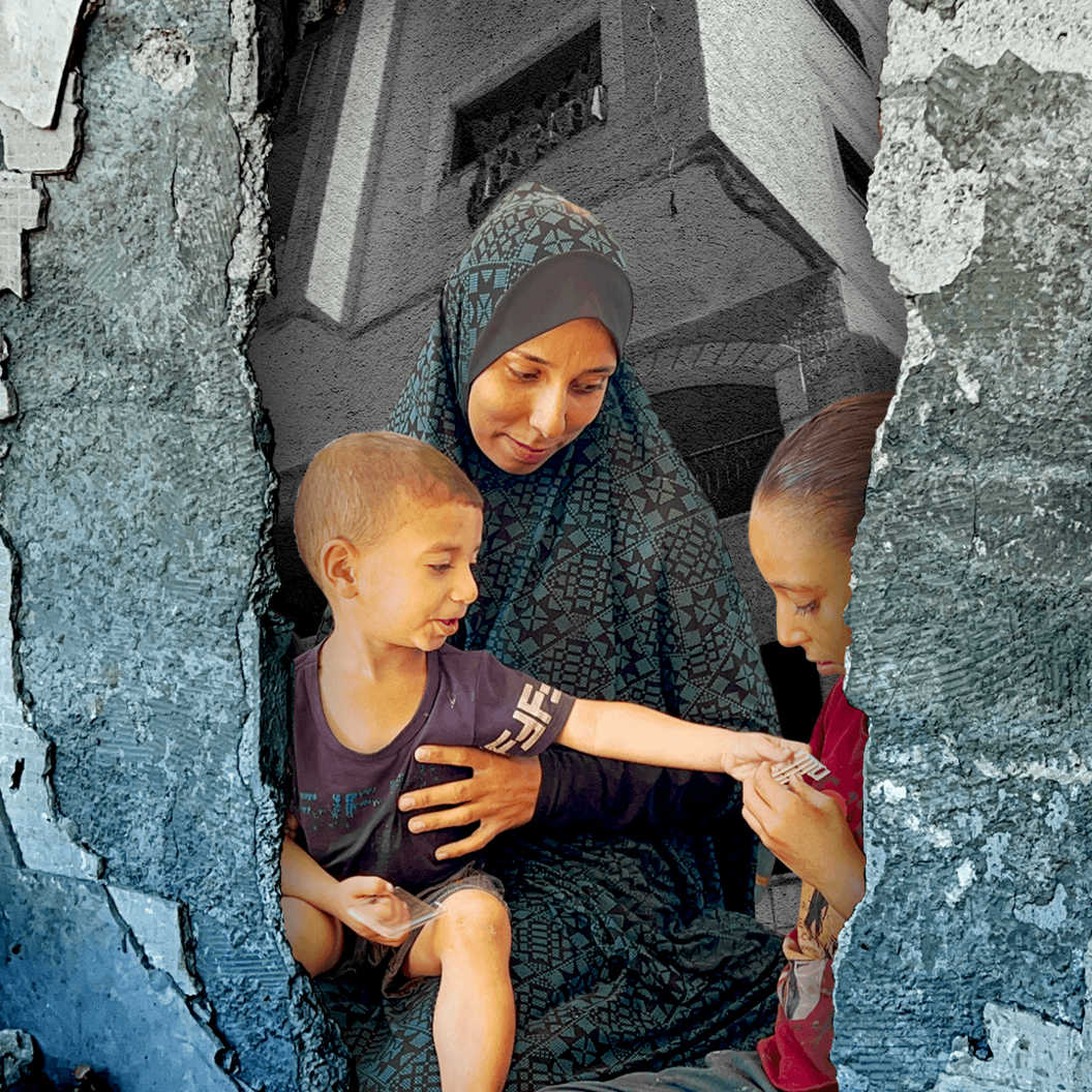 Hadeel holds her son, who reaches out to his sister. The image has a graphic treatment over it that looks like rubble, with the Skeik building in the background.